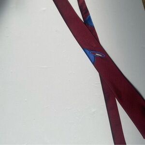 Men’s Bonjour skinny necktie. Red with blue design. Color changing in sunlight.